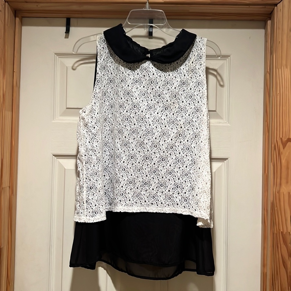 White lace blouse with Peter Pan collar.